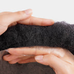 Top view of Afro Skin hair system showing thin skin base and curl pattern